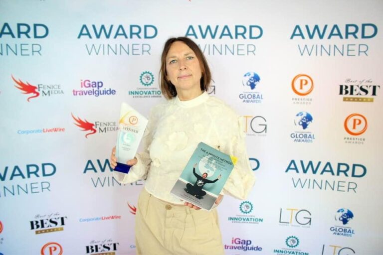 Jenna Robins receiving her Acupuncturist of the Year award, pictured with her 6 Minute Method book